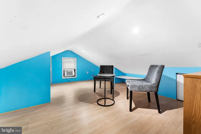 a view of a livingroom with chairs and furniture
