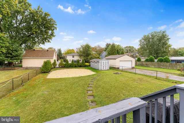 a view of a swimming pool with an outdoor seating and a garden