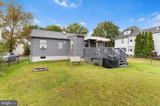 a view of a house with swimming pool and a yard