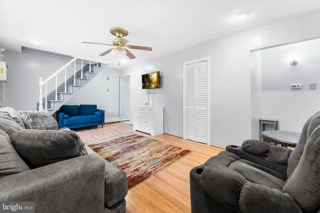 a bedroom with a bed couch and window