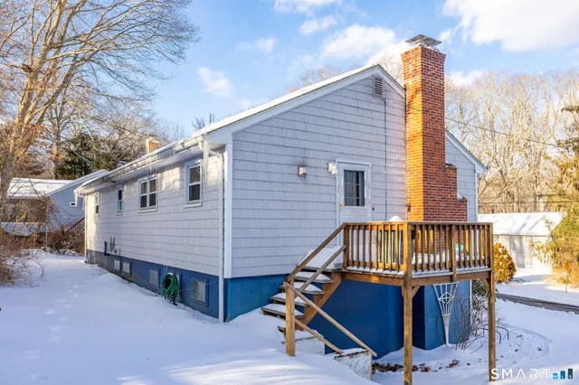 a view of a small house in the middle of a yard