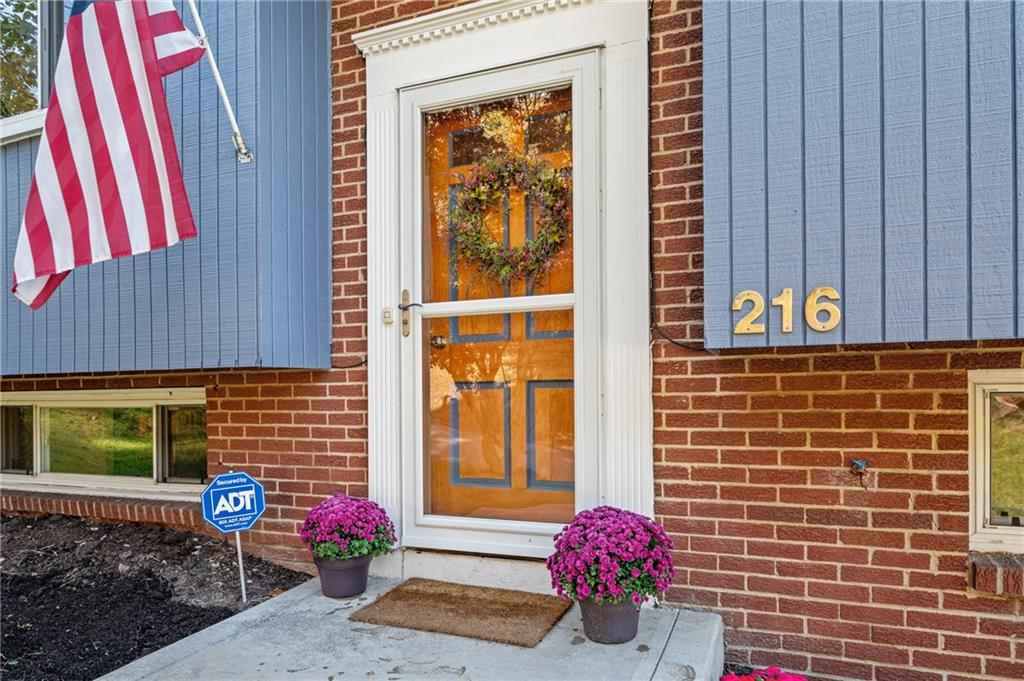 216 Hillendale Road Pittsburgh, PA 15237 - Photo 2 of 25 a view of a door with a potted plant