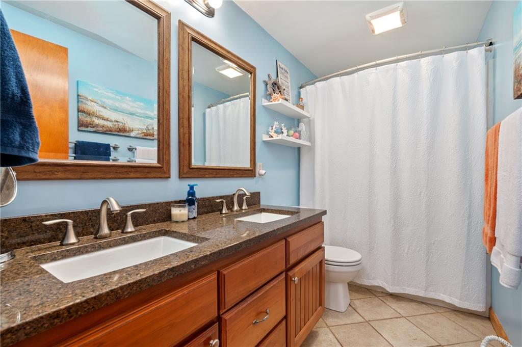 216 Hillendale Road Pittsburgh, PA 15237 - Photo 12 of 25 a bathroom with a granite countertop sink and a mirror