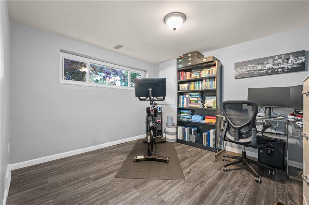 216 Hillendale Road Pittsburgh, PA 15237 - Photo 15 of 25 a view of a workspace with wooden floor and a window