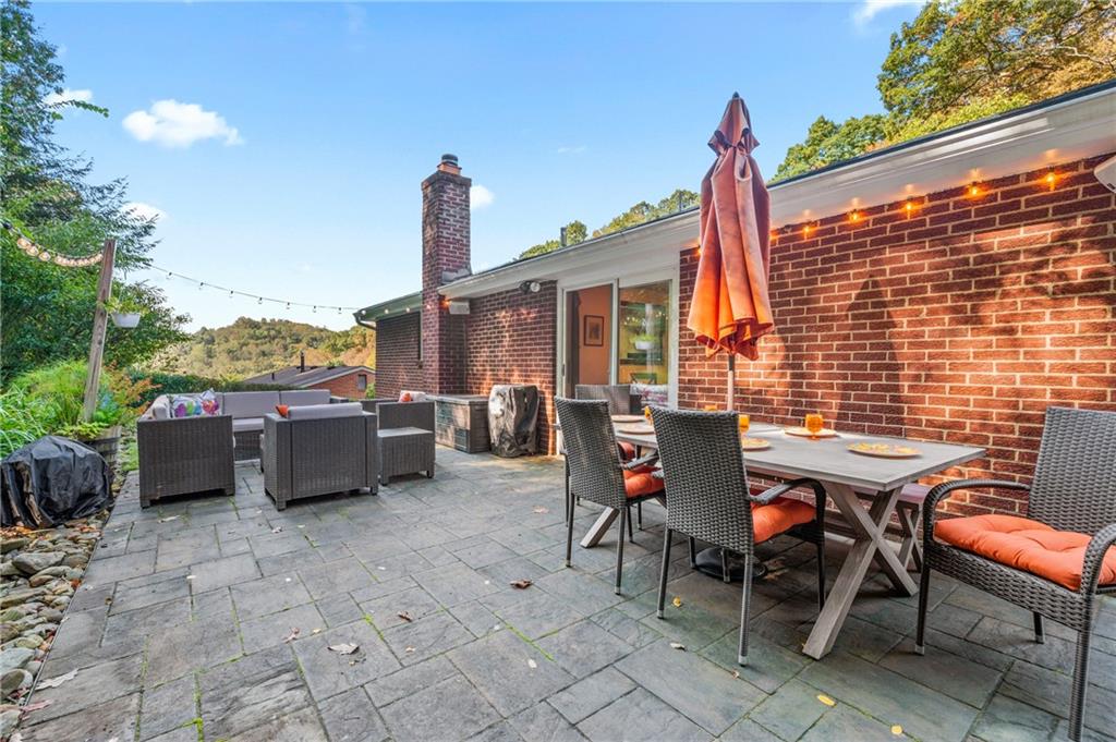216 Hillendale Road Pittsburgh, PA 15237 - Photo 19 of 25 a view of a terrace with table and chairs and potted plants