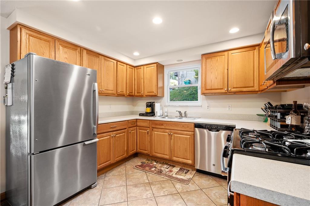 216 Hillendale Road Pittsburgh, PA 15237 - Photo 9 of 25 a kitchen with stainless steel appliances granite countertop a refrigerator sink and stove