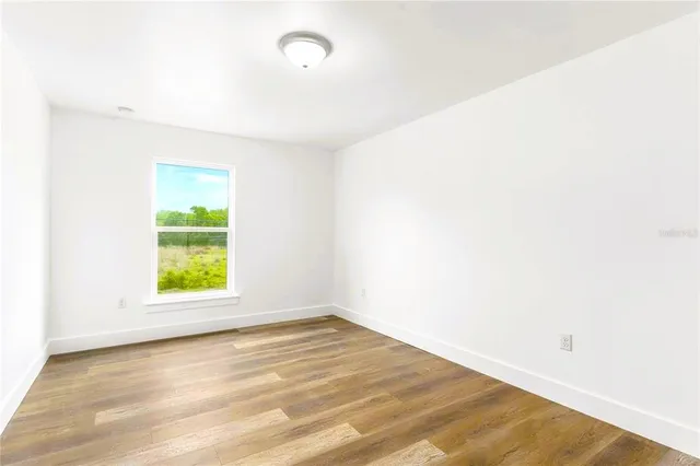 a view of a room that has a window in it