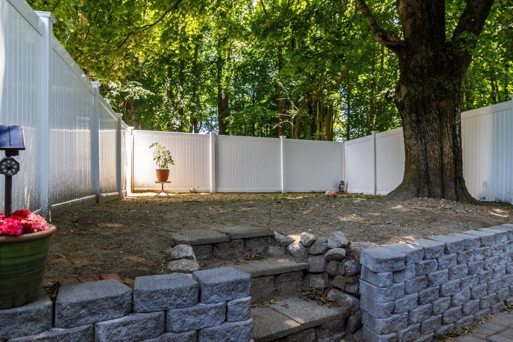 26 Lovell Road Holden, MA 01520 - Photo 18 of 26 a backyard of a house with lots of green space