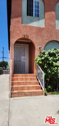 a view of front door of house with stairs