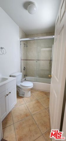 a bathroom with a bathtub and sink