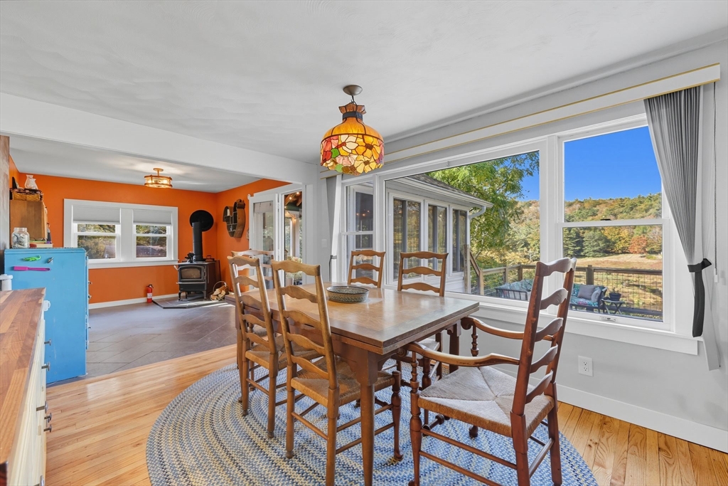 376 NW Road Westhampton, MA 01027 - Photo 14 of 41 a dining room with furniture a livingroom view and wooden floor