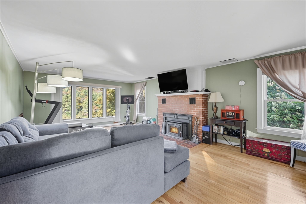 376 NW Road Westhampton, MA 01027 - Photo 23 of 41 a living room with furniture a flat screen tv and a fireplace