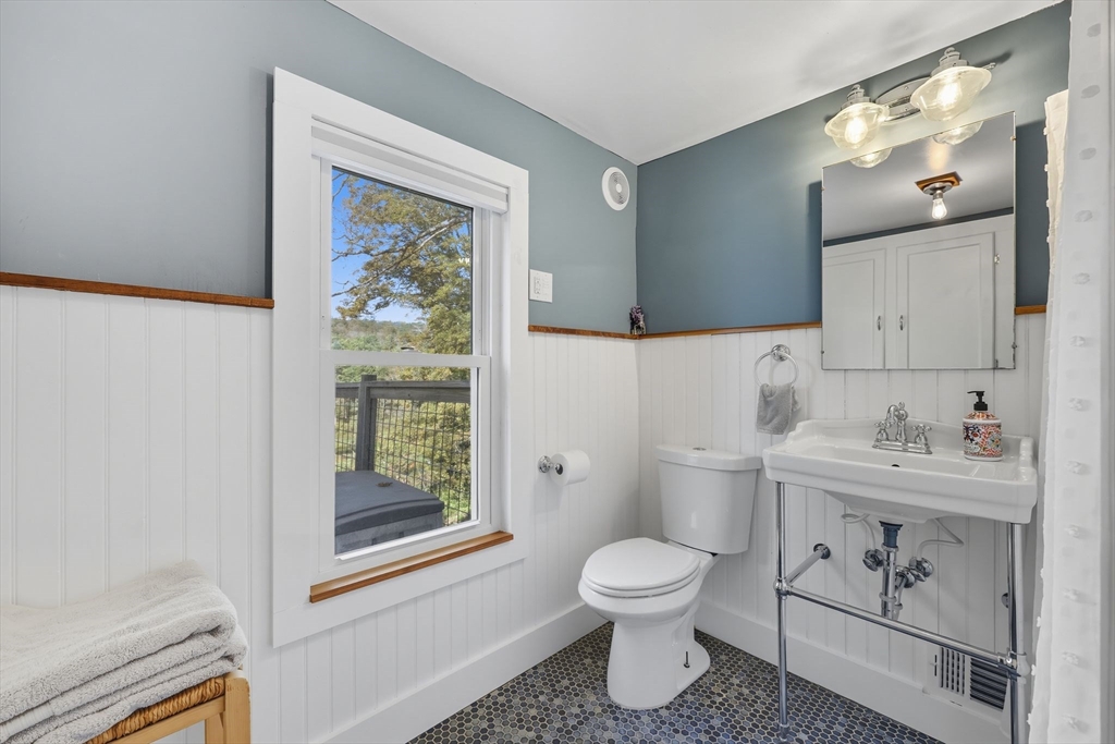 376 NW Road Westhampton, MA 01027 - Photo 27 of 41 a bathroom with a toilet sink and mirror