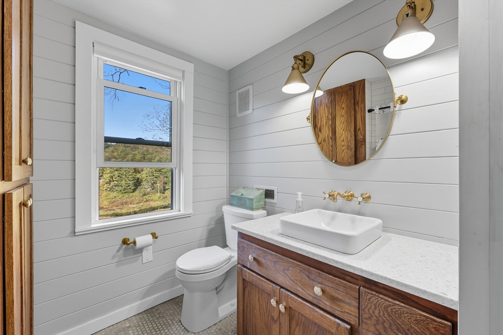 376 NW Road Westhampton, MA 01027 - Photo 35 of 41 a bathroom with a toilet sink and mirror