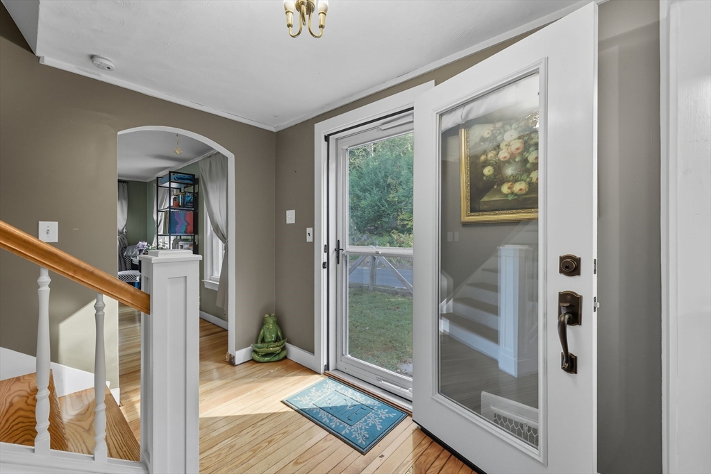 376 NW Road Westhampton, MA 01027 - Photo 4 of 41 a view of a hallway with wooden floor and a living room