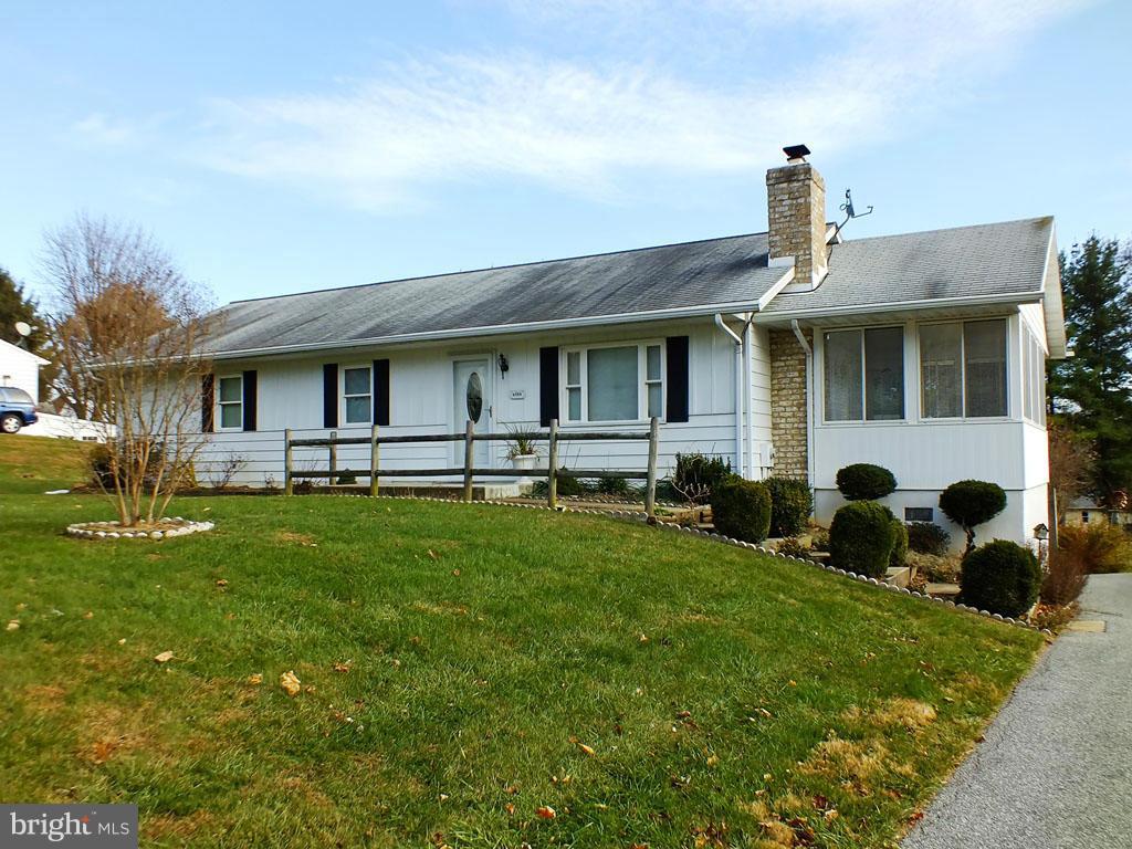 4519 Foxtail Road Hampstead, MD 21074 - Photo 1 of 29 a front view of a house with a yard