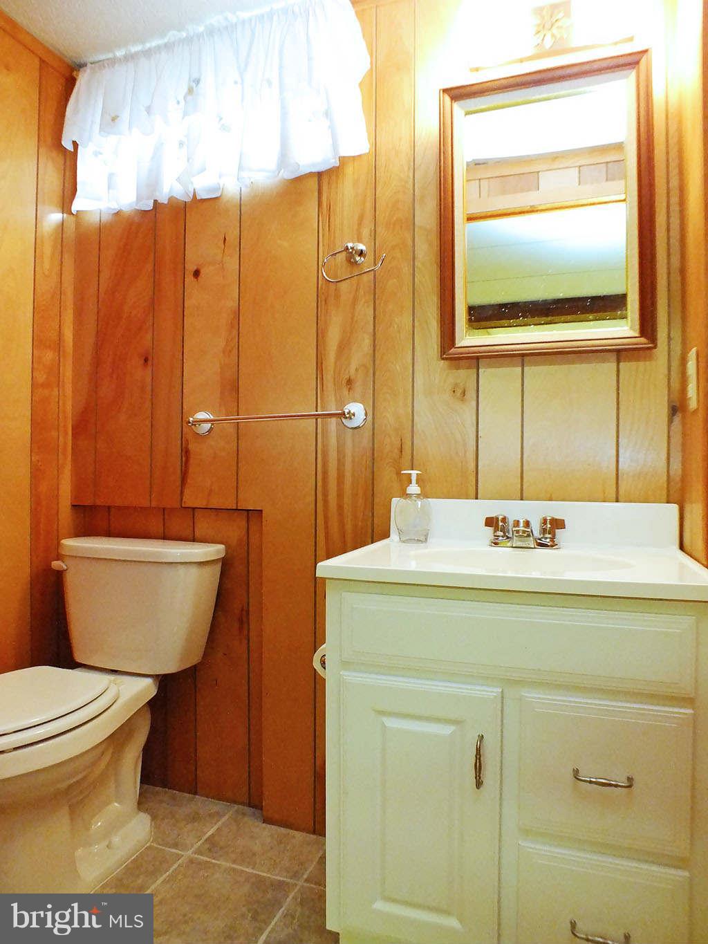 4519 Foxtail Road Hampstead, MD 21074 - Photo 17 of 29 a bathroom with a sink toilet and shower