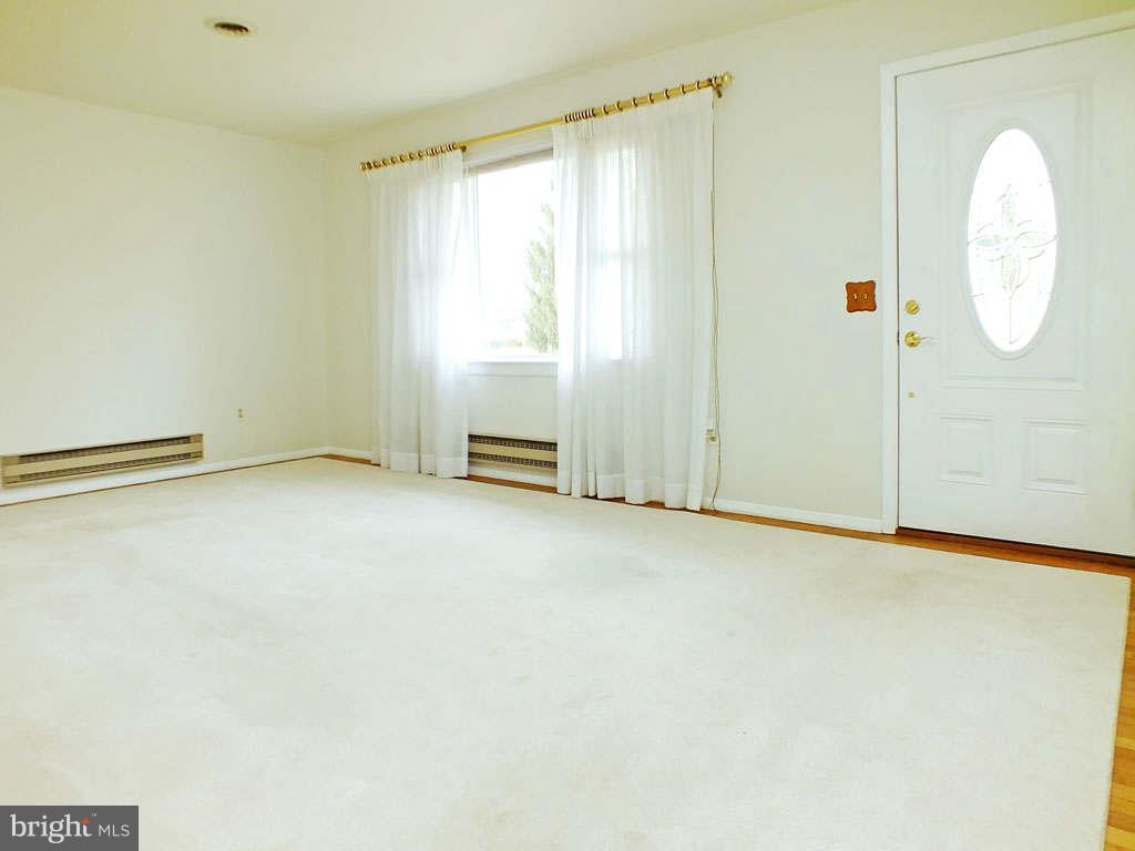 4519 Foxtail Road Hampstead, MD 21074 - Photo 3 of 29 a view of an empty room with a window
