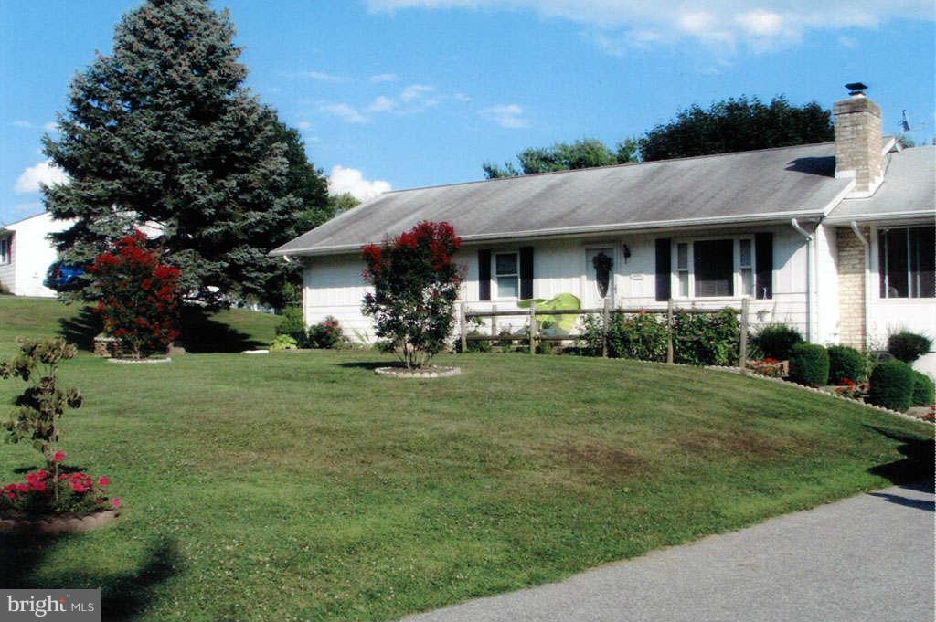 4519 Foxtail Road Hampstead, MD 21074 - Photo 23 of 29 a front view of a house with a garden