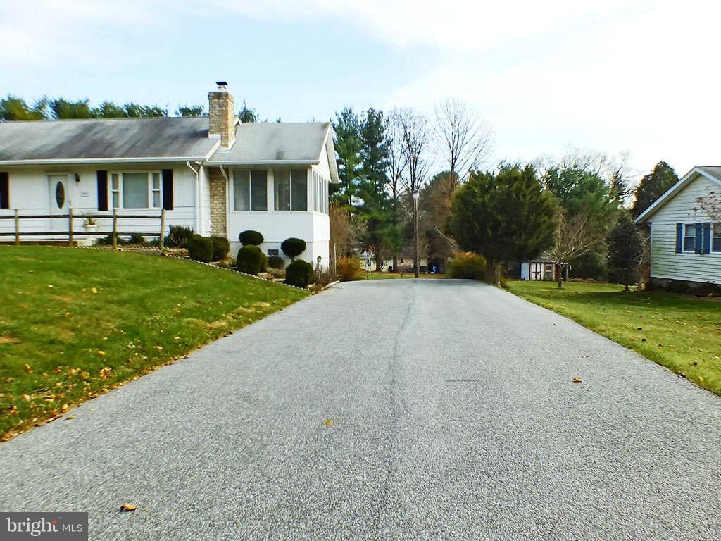 4519 Foxtail Road Hampstead, MD 21074 - Photo 25 of 29 a front view of a house with a yard