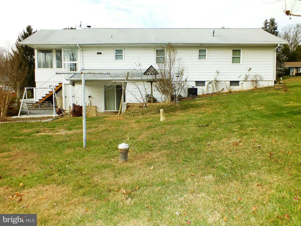 4519 Foxtail Road Hampstead, MD 21074 - Photo 26 of 29 a view of a house with a swimming pool