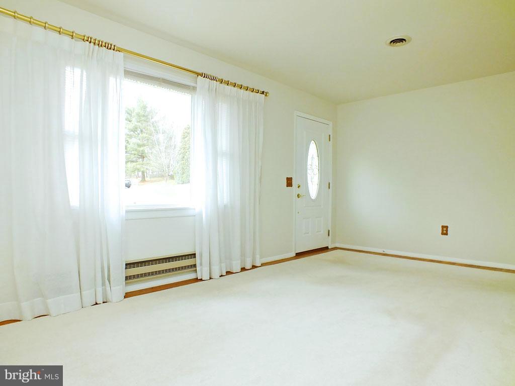4519 Foxtail Road Hampstead, MD 21074 - Photo 4 of 29 a view of an empty room with a window