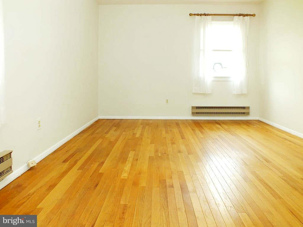 4519 Foxtail Road Hampstead, MD 21074 - Photo 8 of 29 a view of a room with wooden floor and a window