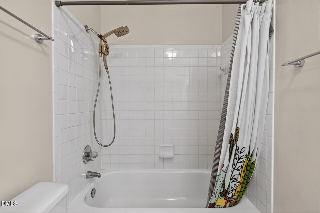 3307 Coachman's Way Durham, NC 27705 - Photo 40 of 50 a bathroom with a shower and a bathtub