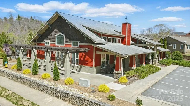 a view of swimming pool with a yard and wooden fence