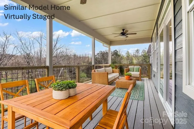 a view of a balcony with lake view and a potted plant