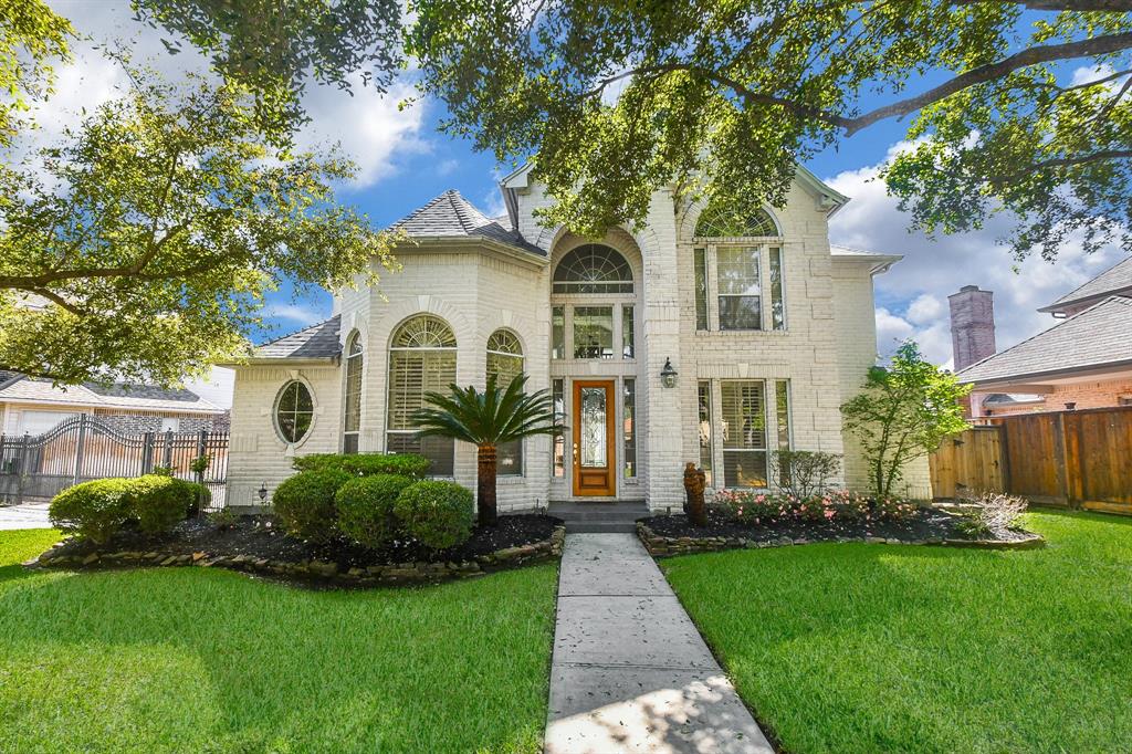 Stately and elegantly warm, this spectacular 2-story, single family brick beauty is located at 8522 Ivy Falls Court, Jersey Village, TX, in the Wyndham Village community. Impeccably maintained, inside and out, the home shows proud ownership and stunning curb appeal