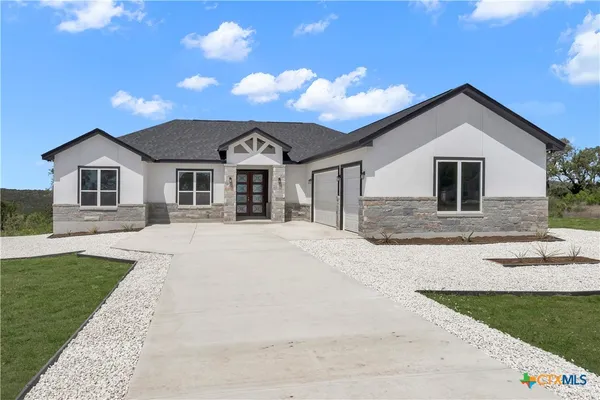 a front view of a house with yard