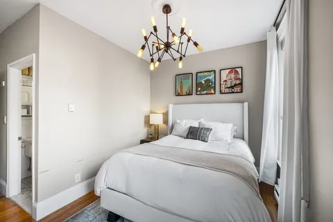 a bathroom with a toilet a sink and a mirror