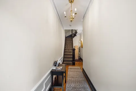 a front view of a brick building with many windows