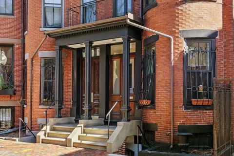 a view of a building with sitting area