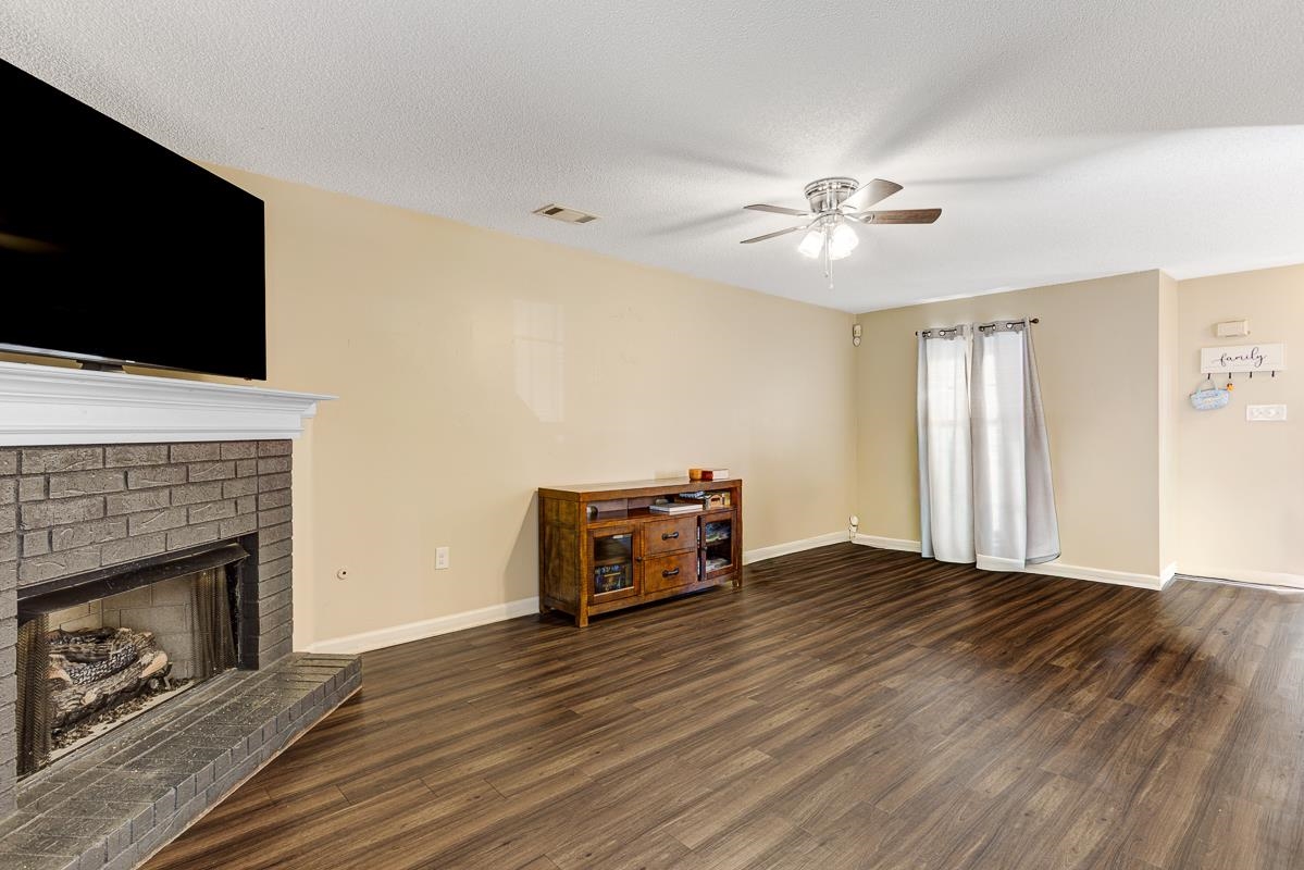 4464 Cedar Ridge Lane Memphis, TN 38128 - Photo 3 of 24 a living room with furniture and a fireplace