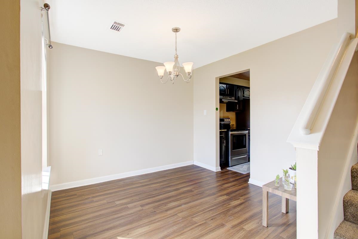 4464 Cedar Ridge Lane Memphis, TN 38128 - Photo 8 of 24 wooden floor in an empty room with a window