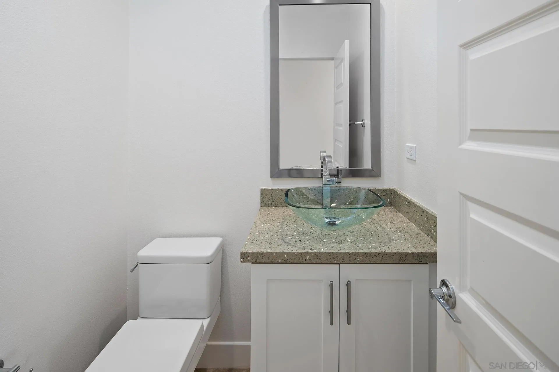1935 North Vulcan Avenue Encinitas, CA 92024 - Photo 11 of 22 a bathroom with a granite countertop toilet and sink