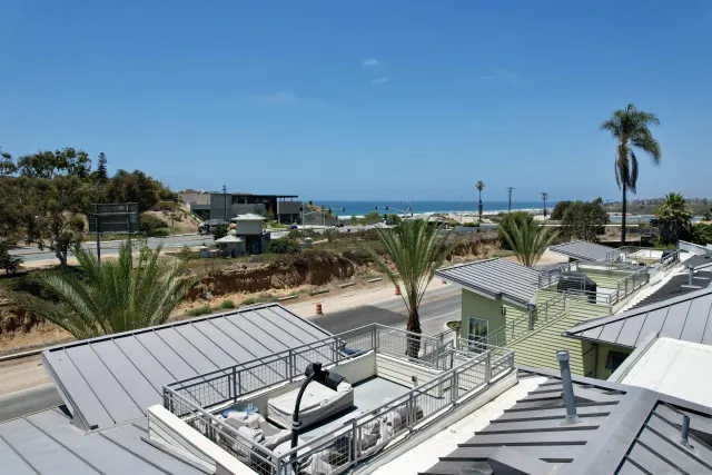 a view of a balcony with chairs