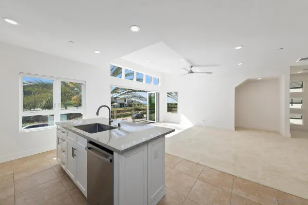 a kitchen with a sink stove and refrigerator