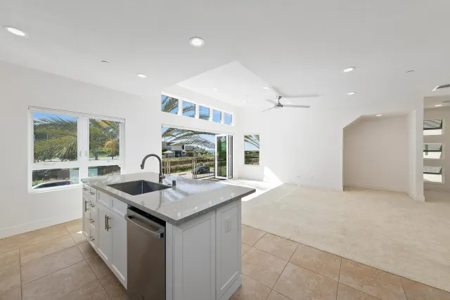 a kitchen with a sink stove and refrigerator
