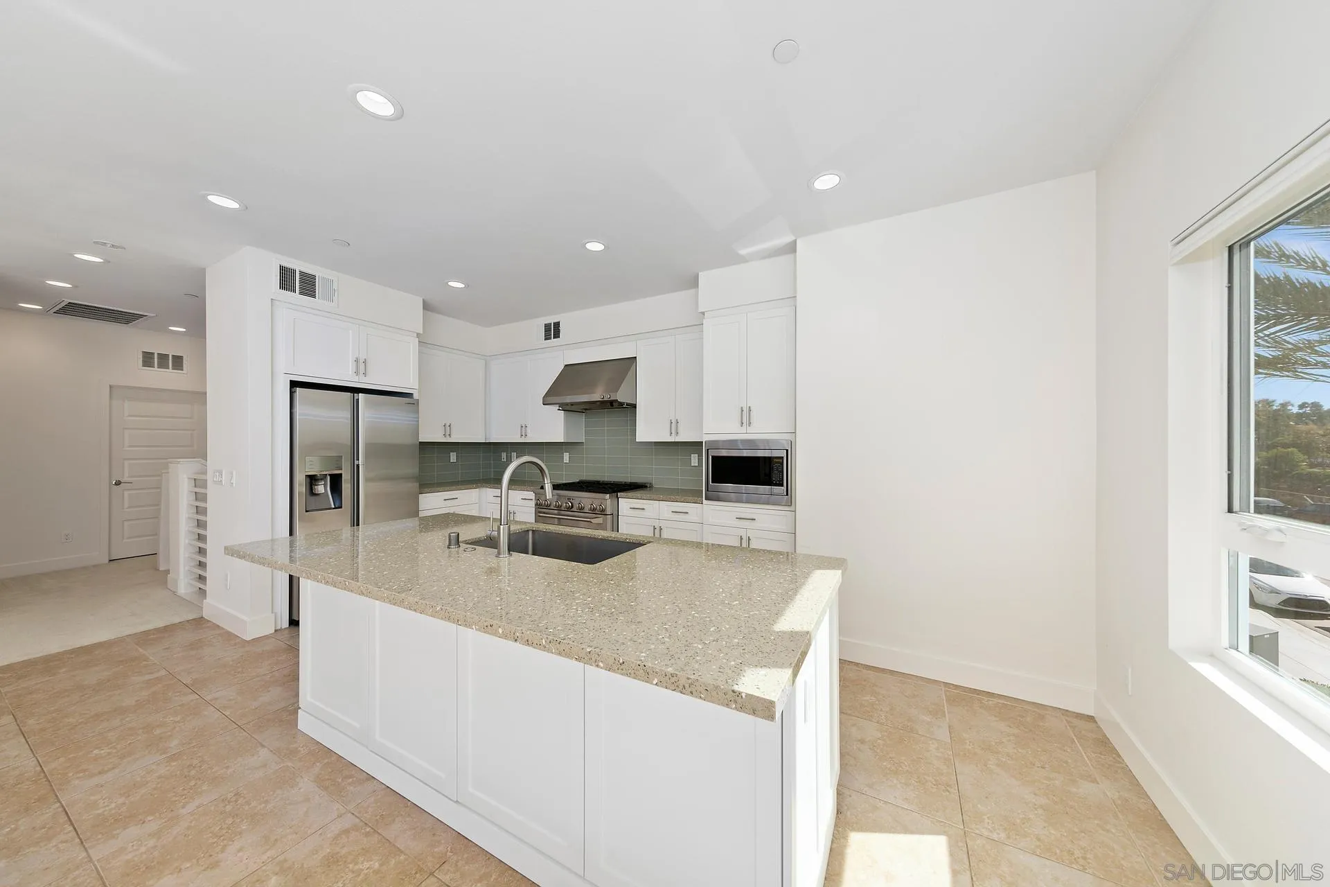 1935 North Vulcan Avenue Encinitas, CA 92024 - Photo 5 of 22 a kitchen with stainless steel appliances a refrigerator sink and microwave