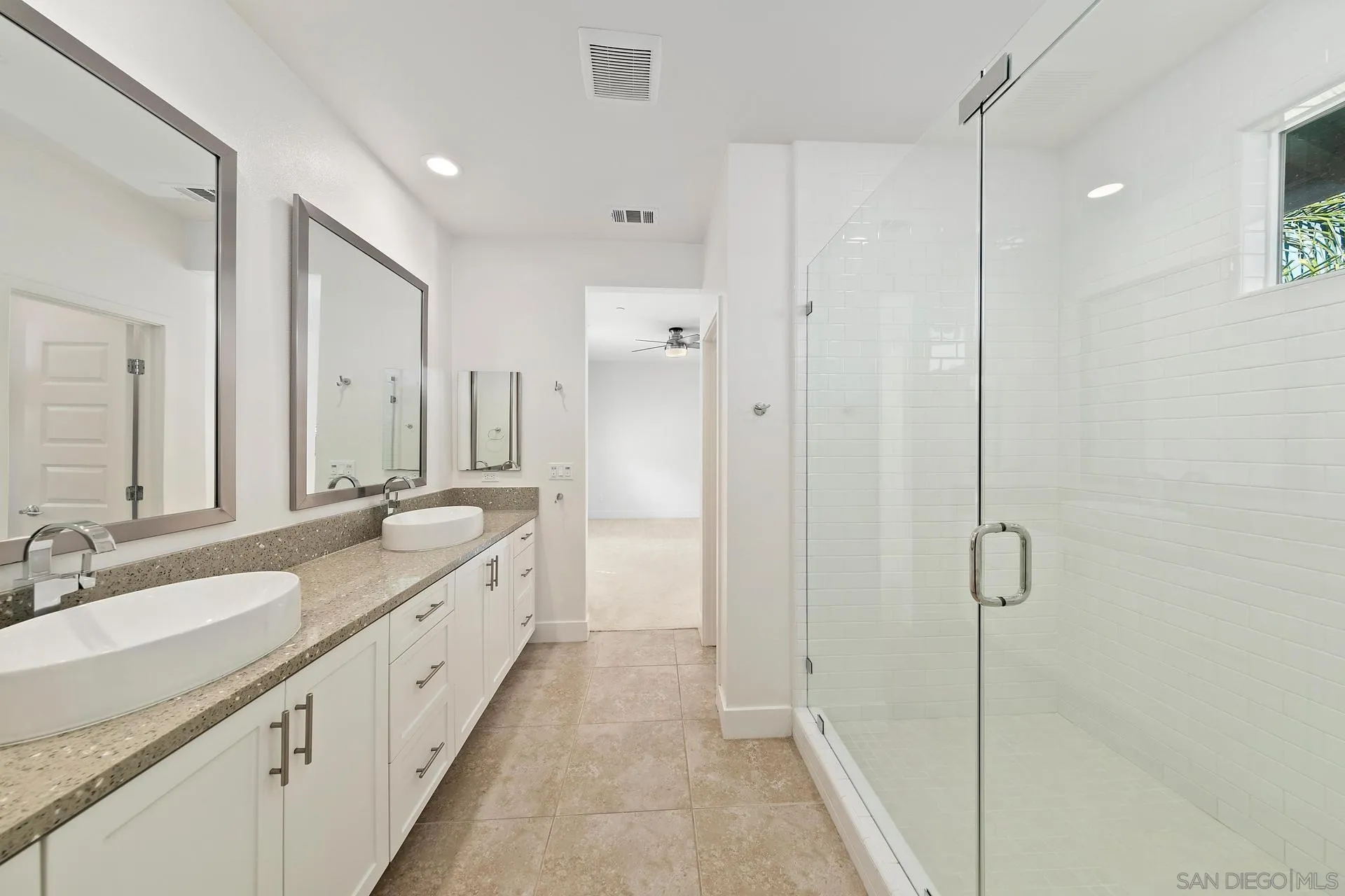 1935 North Vulcan Avenue Encinitas, CA 92024 - Photo 10 of 22 a spacious bathroom with double vanity and mirrors