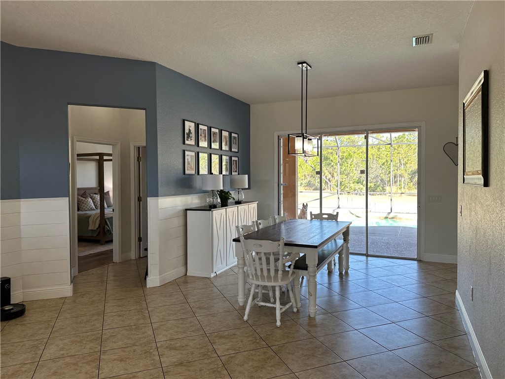 14650 87th Street Fellsmere, FL 32948 - Photo 15 of 36 a dining room with furniture and window