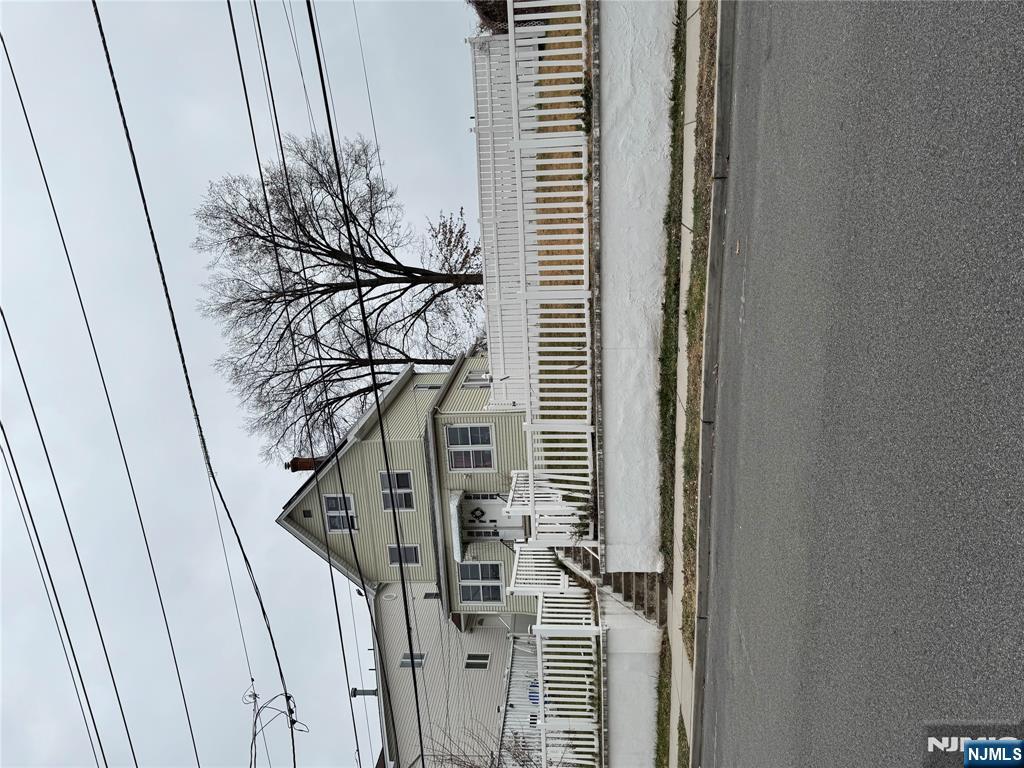 a view of a house with a street