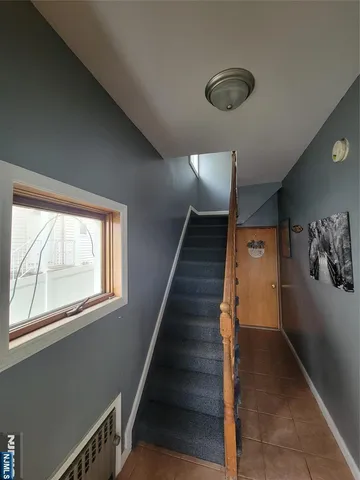 a bedroom with bed and a chandelier