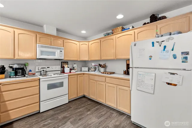 a white refrigerator freezer sitting in a kitchen