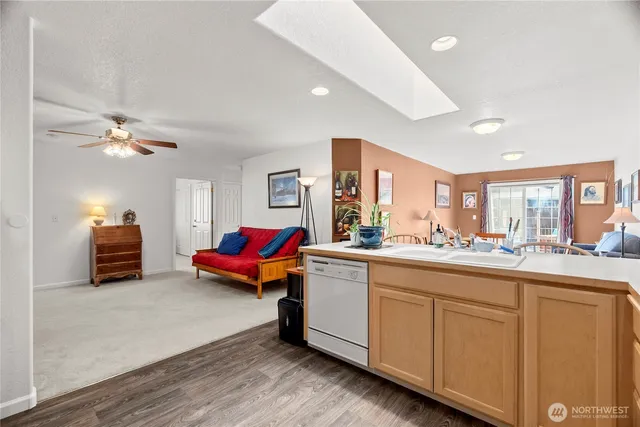 a living room with furniture and chandelier