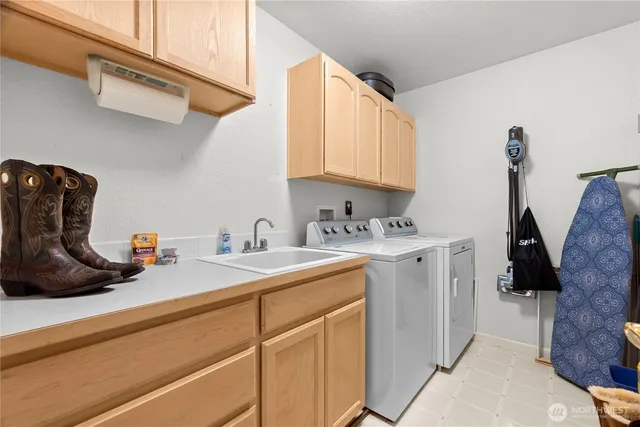 a kitchen with a sink cabinets and a window