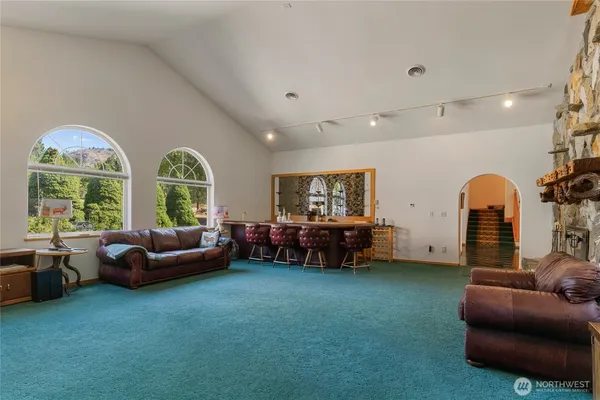 a view of a living room and a swimming pool